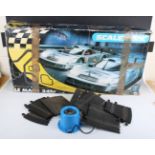 A Scalextric C1050 Le Mans 24hr racing set, boxed, together with a collection of track, trackside