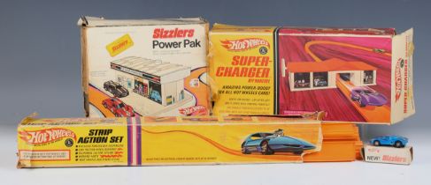 A Hot Wheels Sizzlers No. 6500 Ford MK IV, together with a power pack super-charger, track and