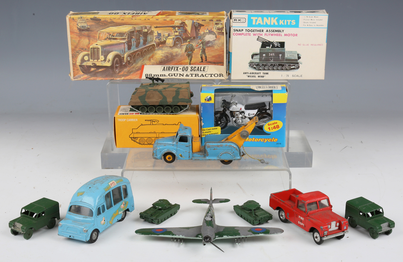 A collection of diecast vehicles, including a Spot-On Land Rover, Budgie Toys, a towing tender and