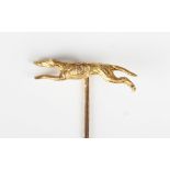 A 9ct gold stickpin, the finial designed as a running greyhound, Birmingham 1979, weight 3g, width