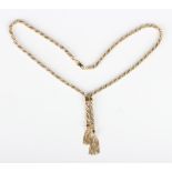 A 9ct two colour gold necklace in a ropetwist link design, the front with two graduated tassel