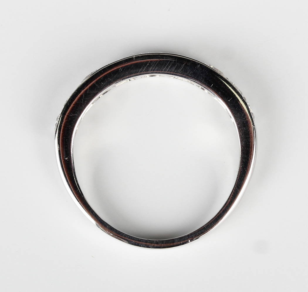 A white gold and diamond nine stone half-hoop eternity ring, mounted with a graduated row of - Image 3 of 5