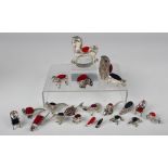 A group of twenty-one modern silver novelty pin cushions, including a rocking horse, snail,
