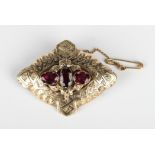 A Victorian garnet brooch, mounted with three oval cut garnets to the centre, otherwise with