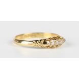 An 18ct gold and diamond five stone ring, mounted with a row of graduated cushion cut diamonds in