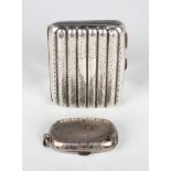 An Edwardian silver curved rectangular six-section cigarette case with foliate engraved