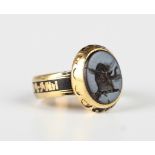 A Victorian 18ct gold and banded agate intaglio ring, engraved with a head of an elephant, with