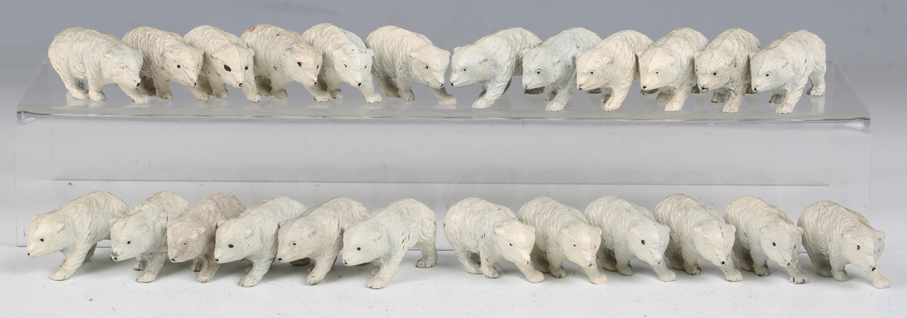 Fifty-five Crescent Toys lead figures of walking polar bear cubs (some damage and paint chips).