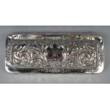 A late Victorian silver rectangular glove box, the domed hinged lid monogram engraved, framed by