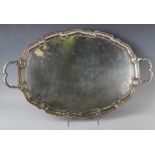 A George V silver oval two-handled tea tray with raised shaped rim, Birmingham 1933 by Charles S.