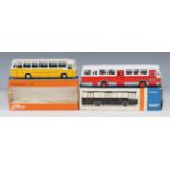 A Tekno No. 950 Mercedes-Benz coach, within a window box, and a Lion Car No. 38 DAF Citybus,