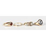 A 9ct gold ring, claw set with a circular cut garnet, ring size approx Q, a 9ct gold and oval