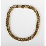 A gold bracelet in a flat curblink design, detailed '750', on a sprung hook shaped clasp,