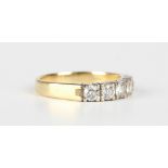 A gold and diamond five stone half-hoop ring, mounted with a row of circular cut diamonds,