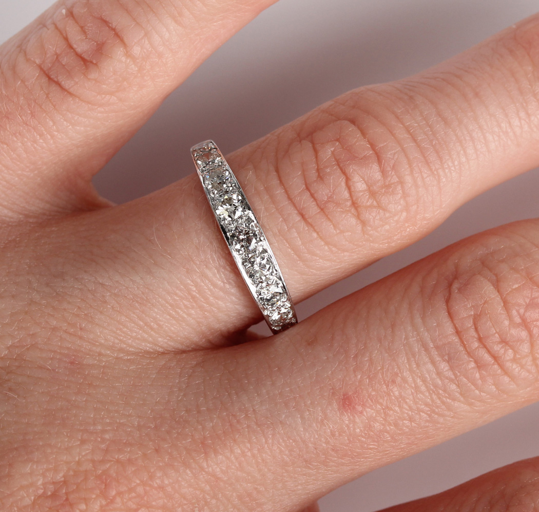 A white gold and diamond nine stone half-hoop eternity ring, mounted with a graduated row of - Image 2 of 5