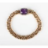 A gold, amethyst and diamond curblink bracelet, the snap clasp mounted with a cabochon amethyst