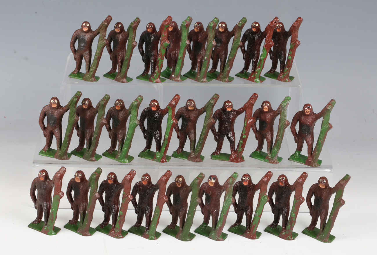 Twenty-five Crescent Toys lead figures of gorillas with treestumps.Buyer’s Premium 29.4% (