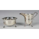 A late Victorian silver milk jug and matching sugar bowl, each of girdled circular form with wavy