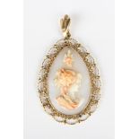 A gold and shell cameo drop shaped pendant, carved as a portrait of a lady within a beaded and