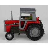 A Britains No. 9522 Massey Ferguson 595 tractor, within a window box (box creased and scuffed,
