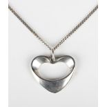 A Georg Jensen silver pendant in an open heart shaped design, designed by Henning Koppel, of