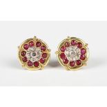 A pair of gold, diamond and ruby earstuds, each designed as a Tudor rose, with post and butterfly