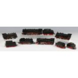 A small collection of Märklin gauge HO railway items, comprising four steam locomotives and tenders,