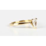 An 18ct gold and diamond single stone ring, claw set with the pear shaped diamond, weight 2.5g,