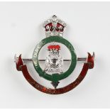 A white gold, platinum, enamelled and diamond military sweetheart brooch, designed as the badge of