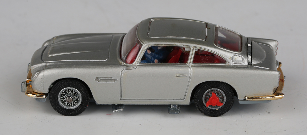 A Corgi Toys No. 270 The New James Bond Aston Martin, silver, with revolving number plates, tyre- - Image 9 of 11