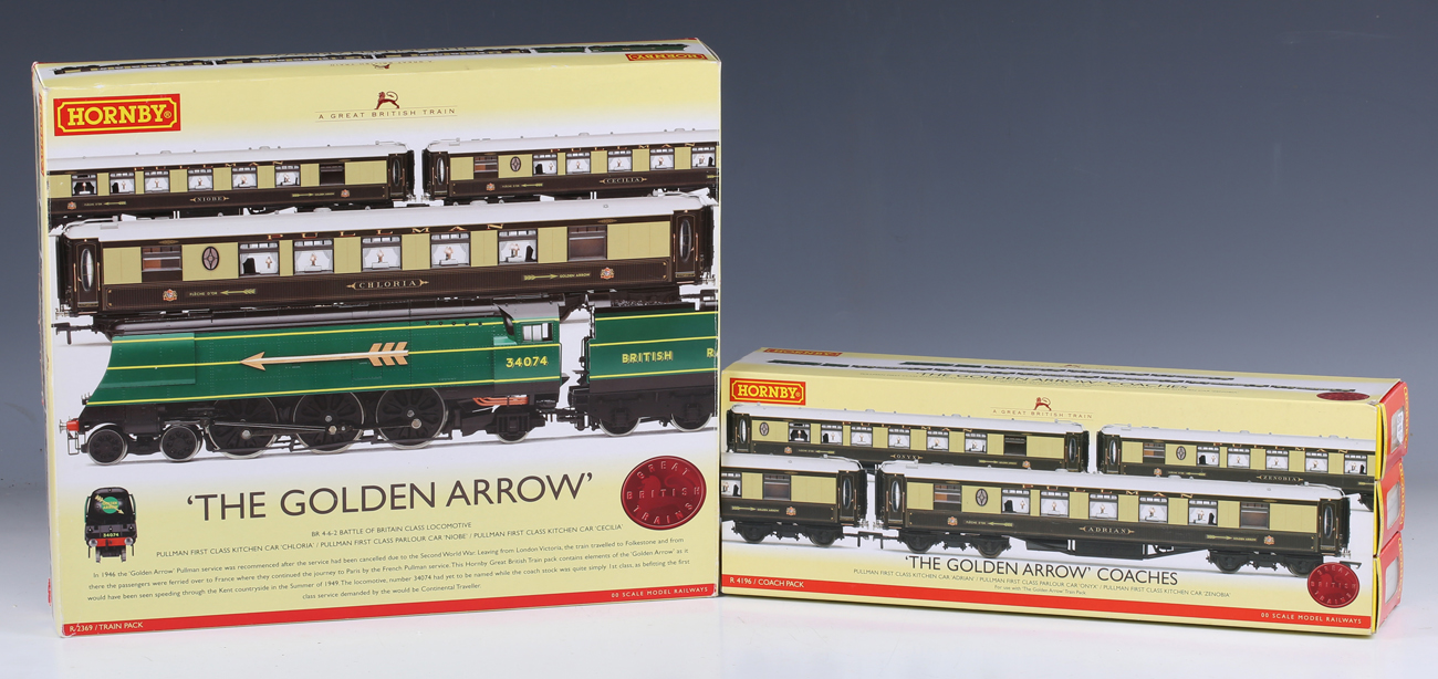 A Hornby gauge OO R.2369 The Golden Arrow train pack and an R.4196 The Golden Arrow coach pack,