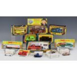 A collection of diecast vehicles, including a Corgi No. 290 Kojak Buick, a No. 470 Disneyland bus, a