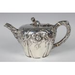 An early Victorian silver circular teapot, the hinged lid with squirrel finial above a tapering body