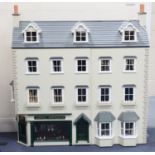 A modern Georgian-style two-storey doll's house/shop with pitched hinged roof, the double-opening