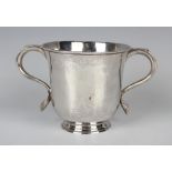 A George II silver porringer, the slightly flared cylindrical body flanked by two scroll handles, on