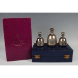 An Elizabeth II graduated set of three silver scent bottles and stoppers commemorating the Silver