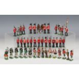 A collection of diecast military figures, including Highlanders, bandsmen and Hussars (playwear