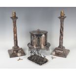 A pair of 19th century plated-on-copper Corinthian column candlesticks, each stem with spiral