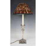 An Edwardian silver candlestick, the urn shaped sconce with festoon decoration above a square