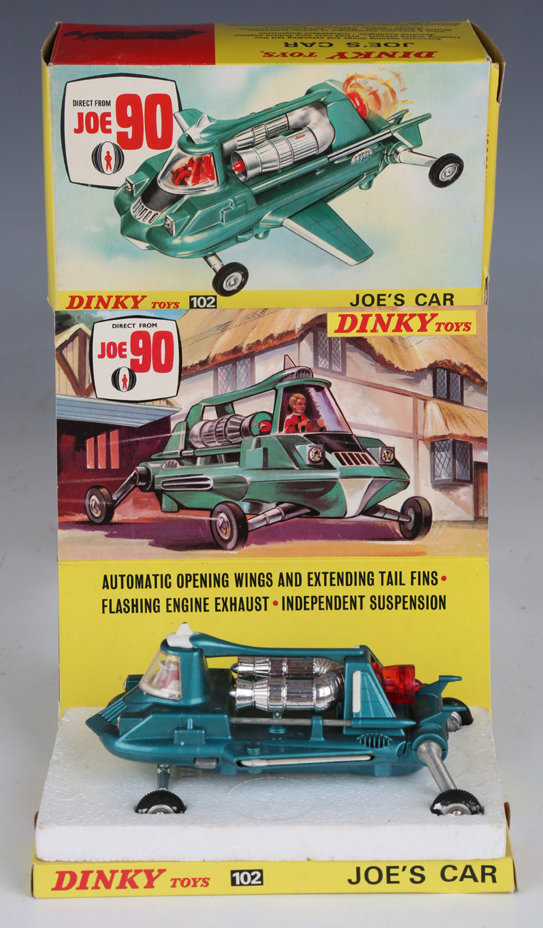 A Dinky Toys No. 102 Joe's Car, boxed with diorama, polystyrene stand and instructions (box