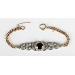 A gold, silver, garnet and colourless paste bracelet, the front collet set with a circular cut