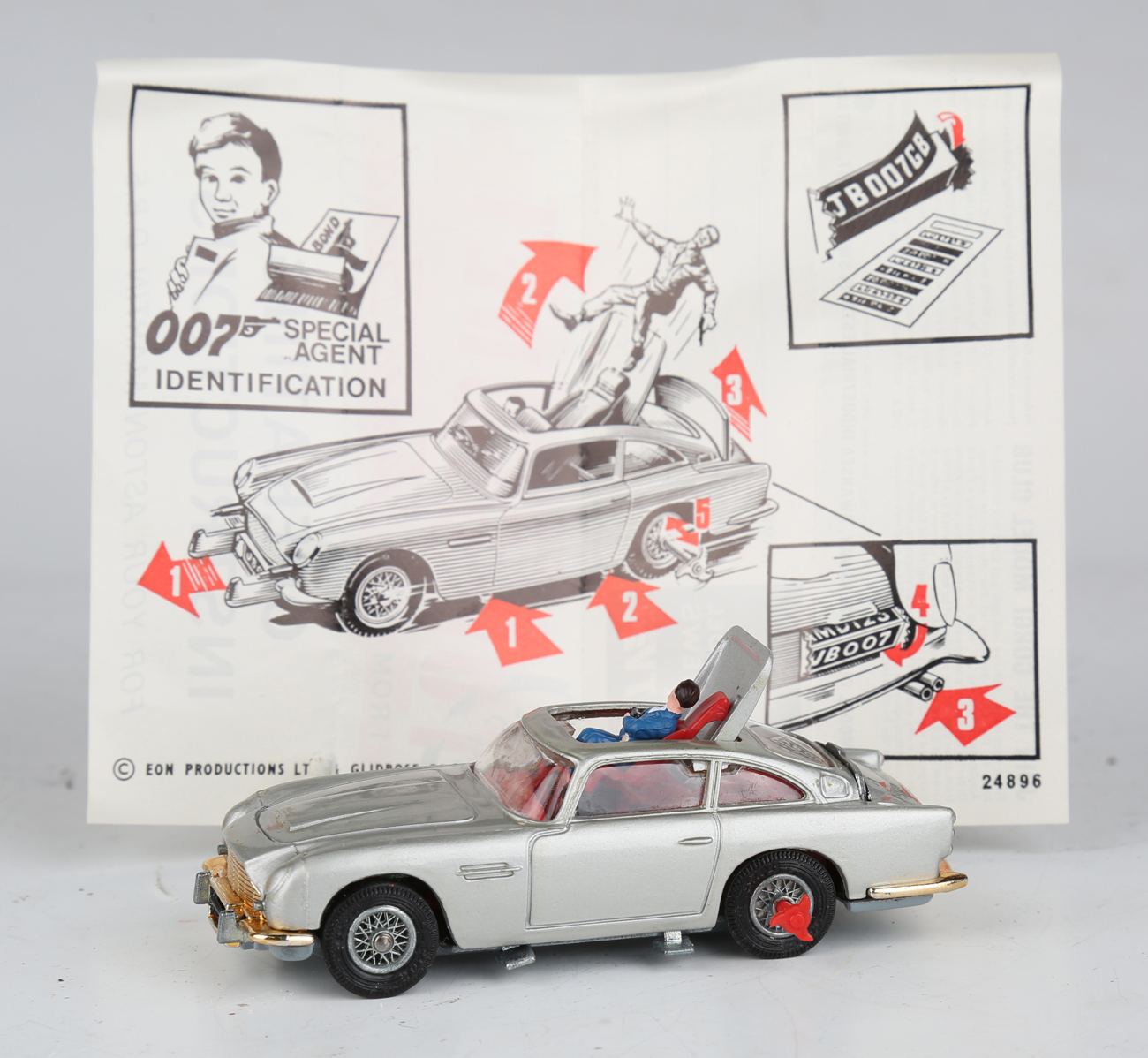 A Corgi Toys No. 270 The New James Bond Aston Martin, silver, with revolving number plates, tyre- - Image 10 of 11