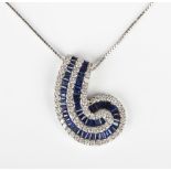 A white gold, sapphire and diamond pendant in a scroll design, mounted with calibre cut sapphires