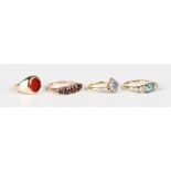 A 9ct gold and garnet five stone ring, mounted with a row of five graduated circular cut garnets,
