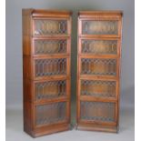 A pair of early 20th century oak Gunn patent sectional glazed bookcases, each fitted with five