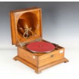 An early 20th century Saphone gramophone by Pathé, within an oak case, width 35cm.Buyer’s Premium