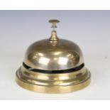 A late 19th/early 20th century brass counter bell of large proportions, diameter 15.5cm.Buyer’s