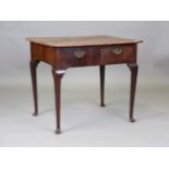 A George II mahogany silver table, fitted with two opposing drawers, on tapering legs and pad