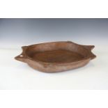 A large carved wooden bowl, probably South-east Asian, width 64cm.Buyer’s Premium 29.4% (including