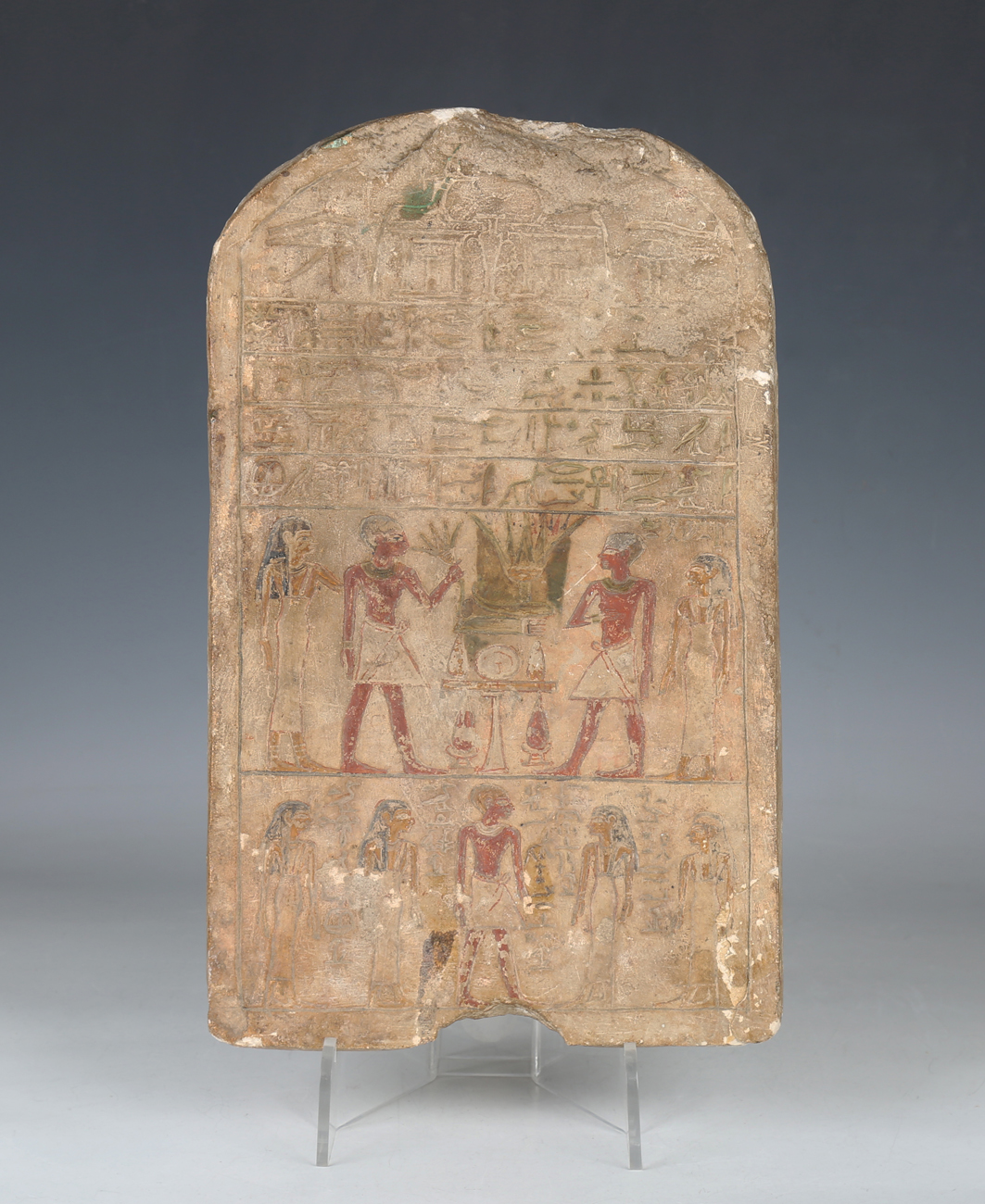 An Egyptian stone stela (grave marker), Middle Kingdom, 1991-1783 BC, the arched rectangular